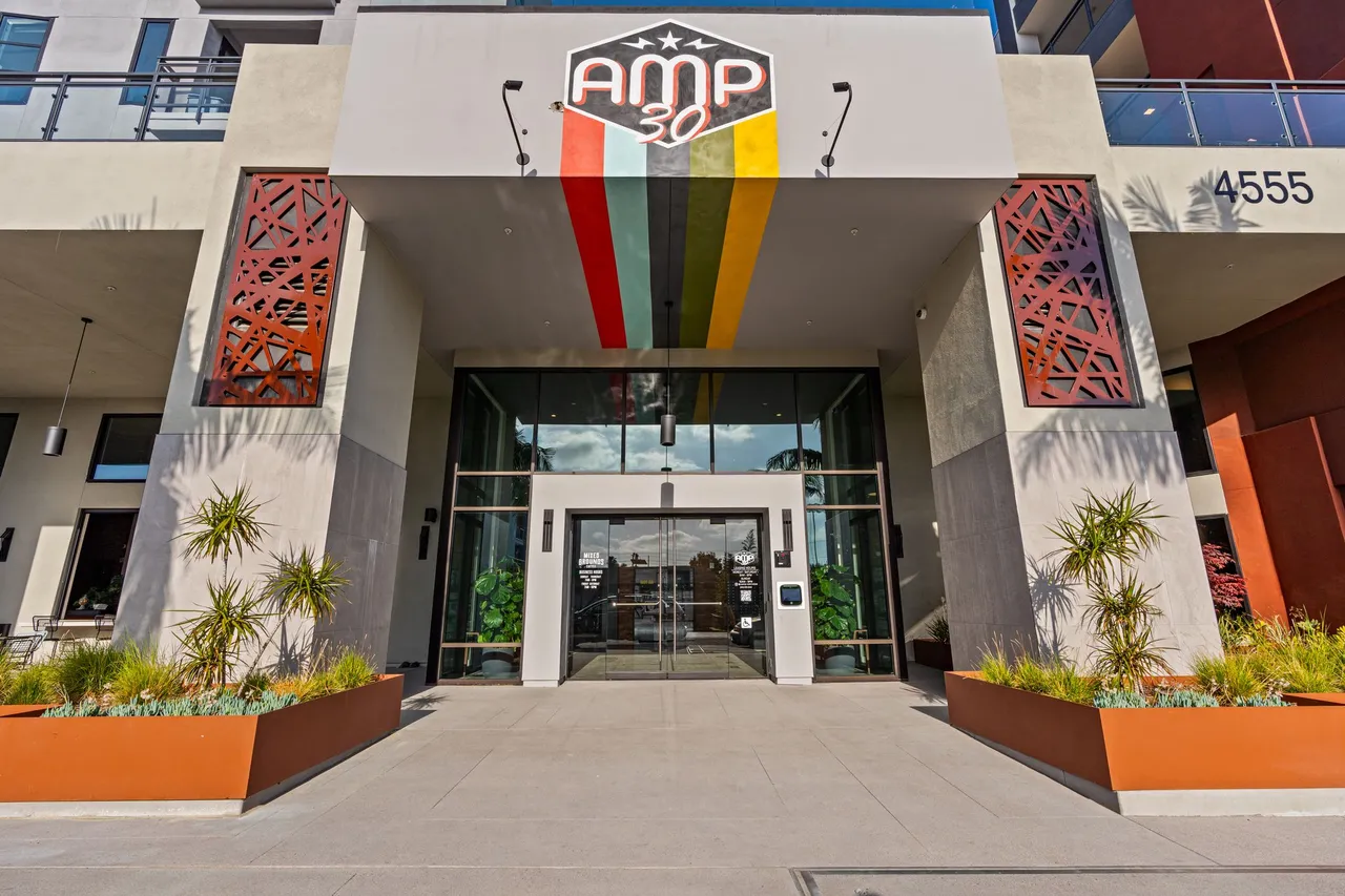 Building entrance with a painted sign on 30th Street