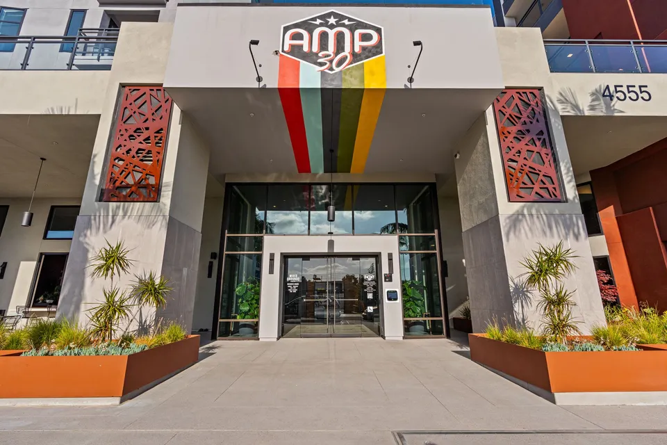 Building entrance with a painted sign on 30th Street
