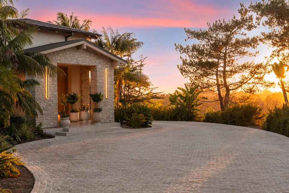 Front entry and motor court at sunset