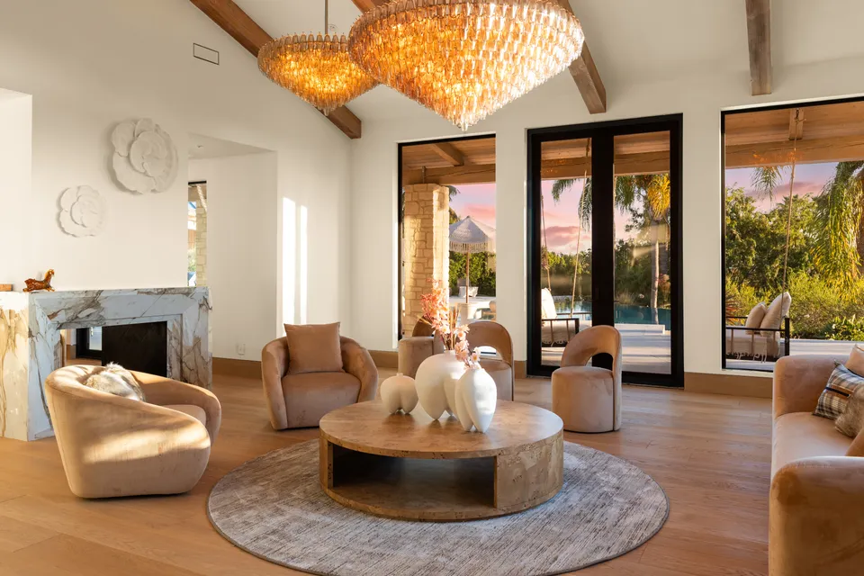 Family room with a fireplace and doors to the terrace