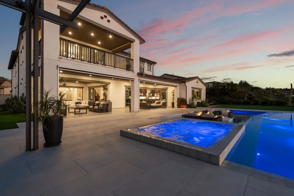 Covered loggia and pool at dusk