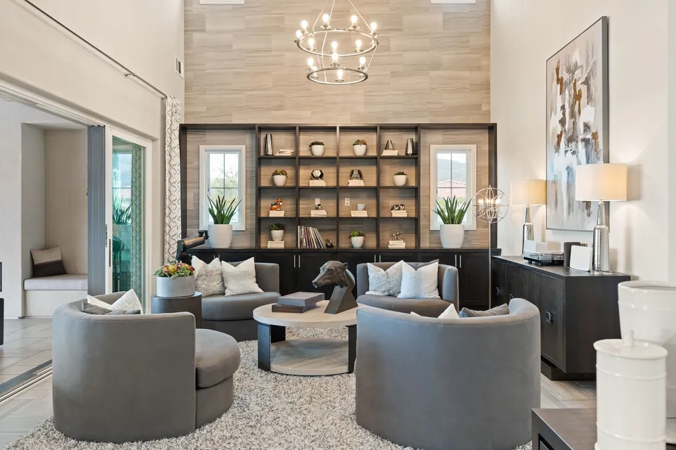 Great room with a chandelier and built-in shelving