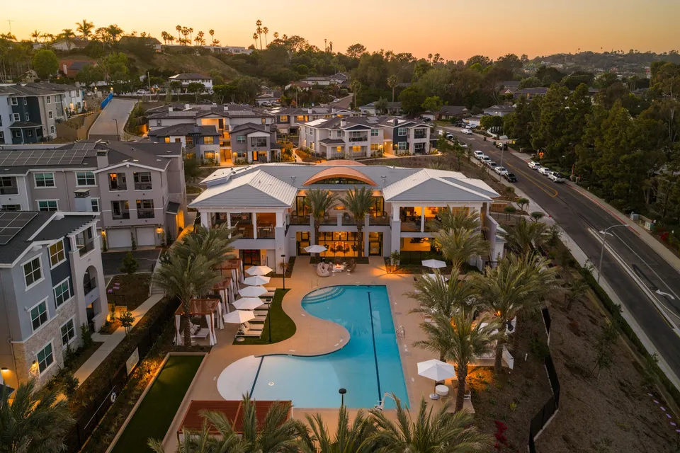 Aerial photo of the community and pool at sunset