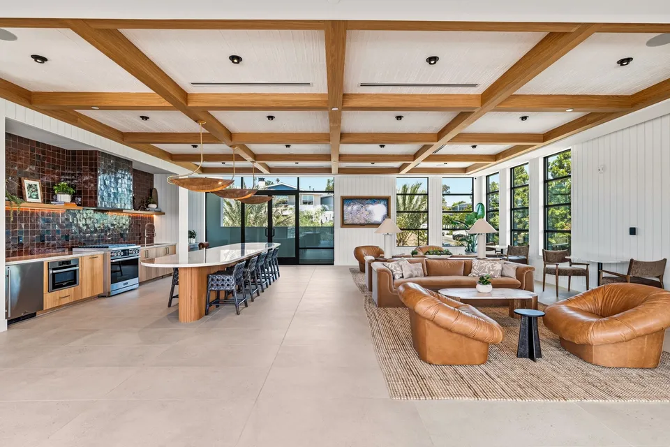 Clubhouse kitchen and lounge under a beamed ceiling